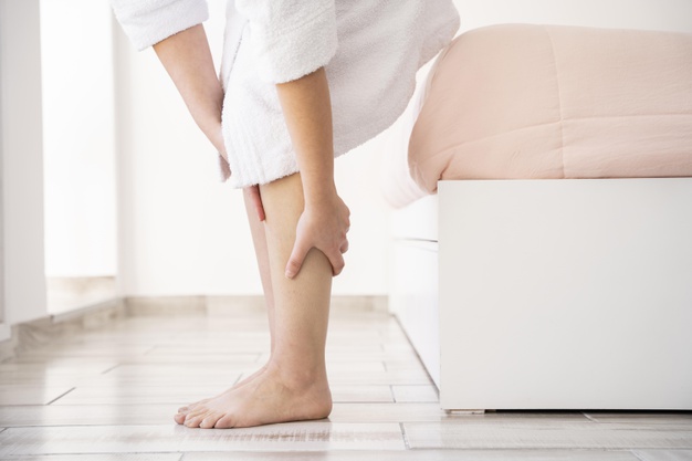 close-up-hands-massaging-legs_23-2148708072